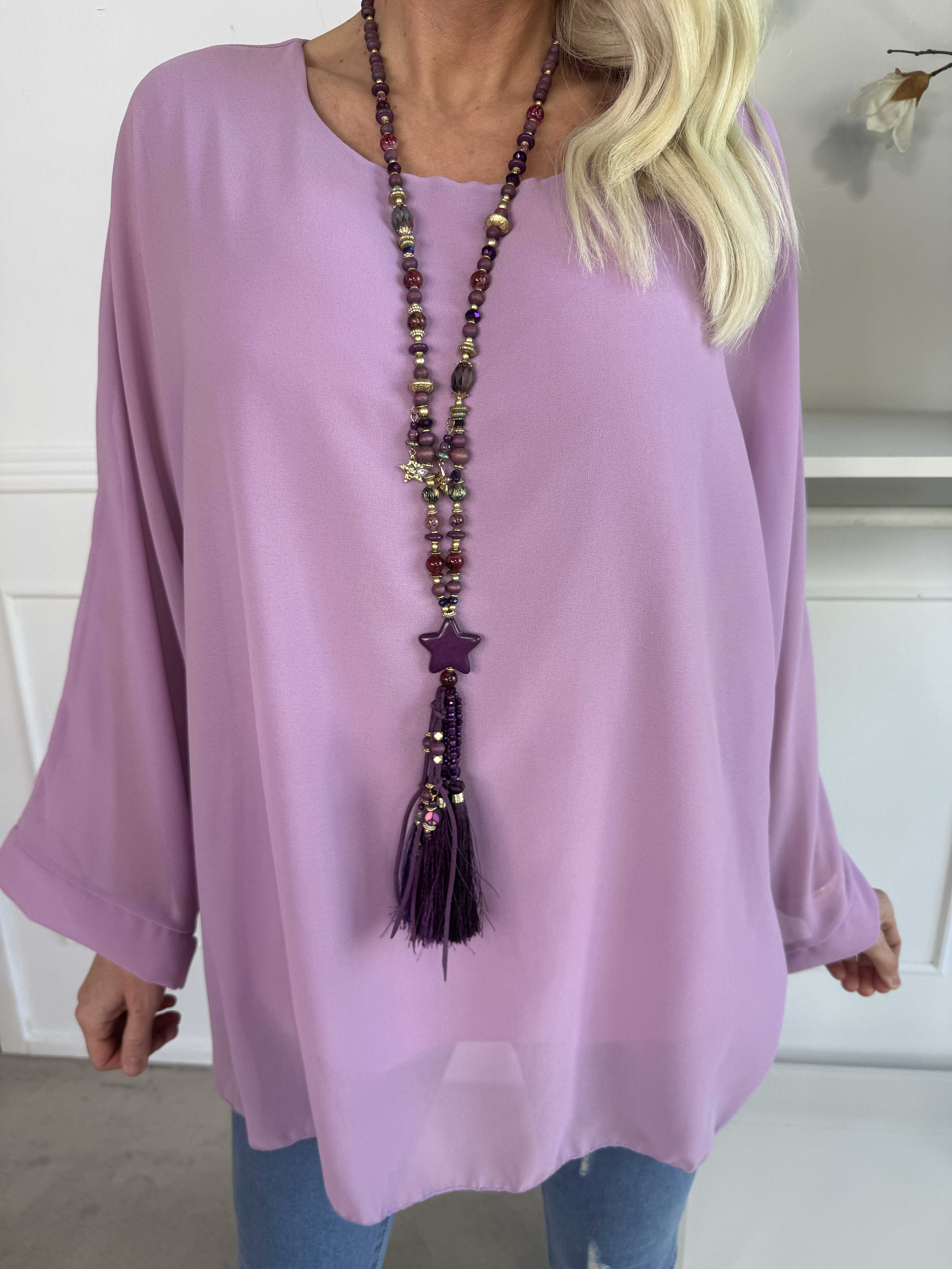 Flores - Tunika med chiffonglager och halvgenomskinliga ärmar